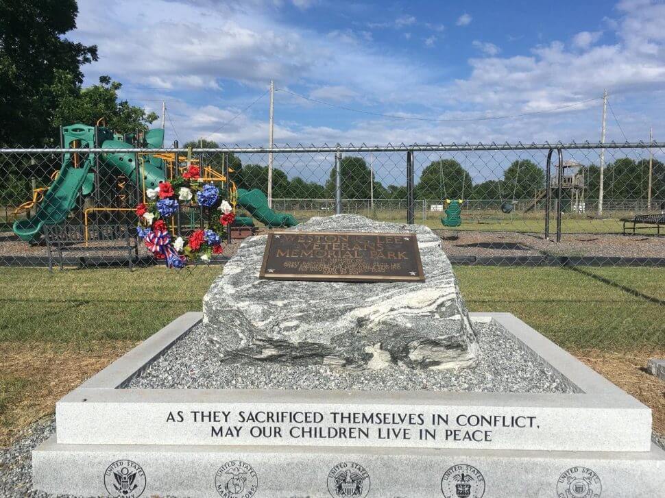 memorial stone in bluffton, GA that says ''as they sacrified themselves in conflict, may our children live in peace"